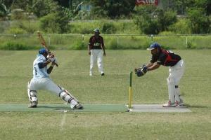 Brian Bell wicket keeper Ipi Morea attemps to stump a Telikom Titans batsman