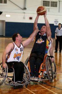 Craig Cannane shoots over the outstretched hands of  Grant Mizens
