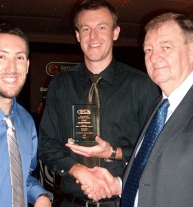 Cameron Tragardh receiving his award with Team Manager Mark Svenson and QBL Player Josh Darragh