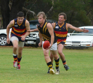 Rd 4 - BDT v LAM : Damian Stott of BDT about to lay a tackle on Craig Altus of Lameroo in the B grade.