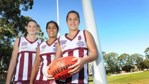 Tayla Harris (left) and Ally Anderson (right), have been selected for the All Australian team. They're pictured with their Queensland U/18 AFL teammate Kristienne Hudson. Picture: Ric Frearson Source: Quest Newspapers 