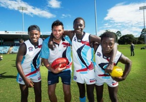 KING OF THE KIDS: Former Carlton and GWS Giants player Setanta Ó hAilpín with All Nations Cup players Blaise Singizwa (Kenya), Kaman Malou (South Sudan) and James Demby (Sierra Leone). Photo: Trevor Veale/Coffs Coast Advocate