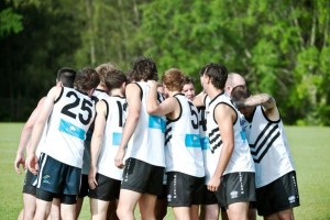 The Port Macquarie players give each other a last minute rev-up prior to the Magpies clash against Coffs Swans. Photo: Rob Wright/Coffs Coast Advocate