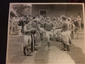 Bernie Banjo Patterson running onto McLeod FC oval for his 200th game for West Preston. Notable Faces: Phil Nobby Howard at front, Mark Mirac Mellerick 2nd out & a young Brian Flynne behind the fence 