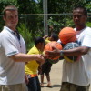 Ryan Burns donating basketballs on behalf of the Pohnpei Basketball Association to teacher Rememster Johnna