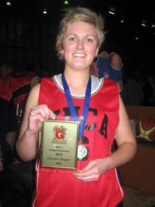 Charmaine with her MVP trophy and premiership medal.