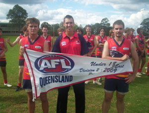 2010 Crows Captains Smith & Neumann, along with Coach Webb are handed the 2009 Premiers flag